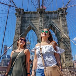 Two women on a bridge in New York.